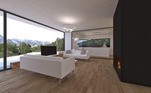 Salón con cristalera panorámica en vivienda mediterránea de piedra en Orba - Alicante, en la montaña, realizada por Chiralt Arquitectos Valencia.
